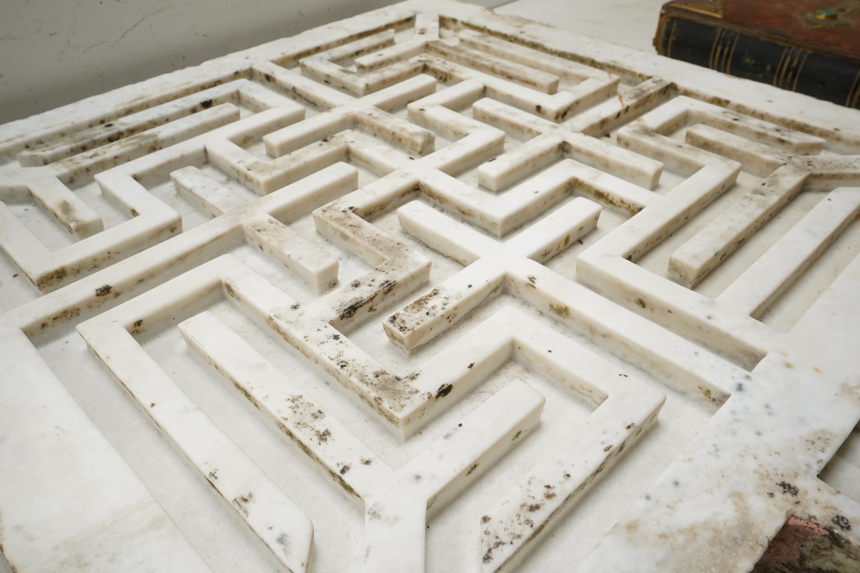An 18th century Indian white marble rain catcher water maze or labyrinth, 72cm x 61cm